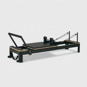 Reformer Pilates aluminium noir pour studio professionnel